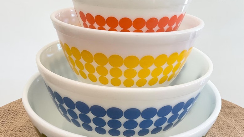 A set of four bowls featuring the Pyrex Dots pattern