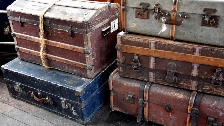 A collection of antique travel trunks