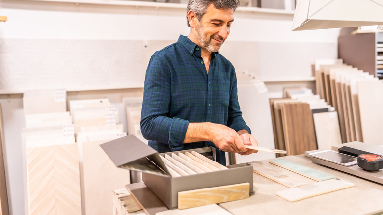 Man selecting flooring for a home renovation