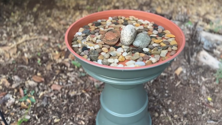 A DIY birdbath made with terracotta pots