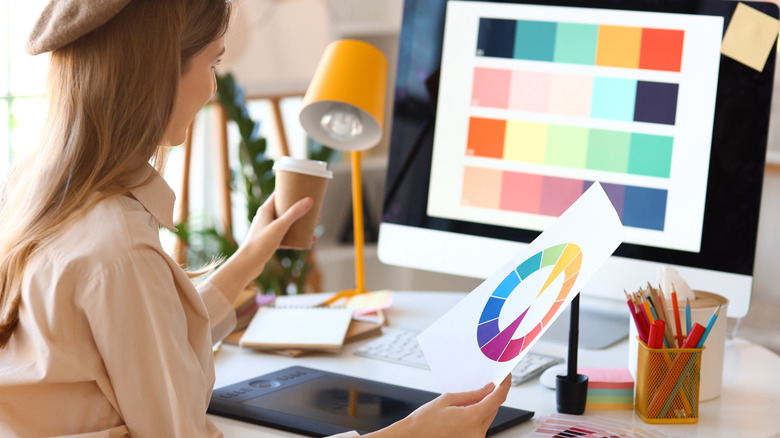 Woman looking at color schemes on computer