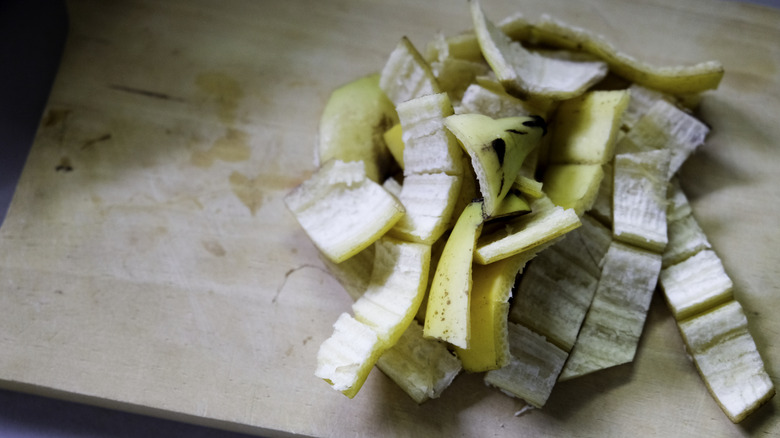 Chopped up banana peel on cutting board