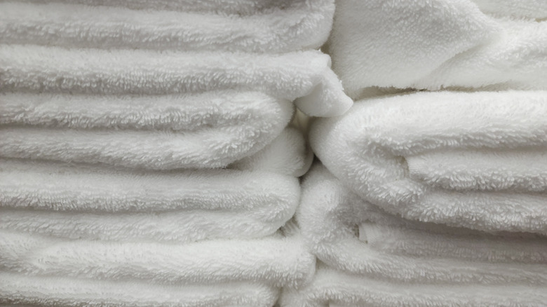 Close-up photo of folded white bath towels