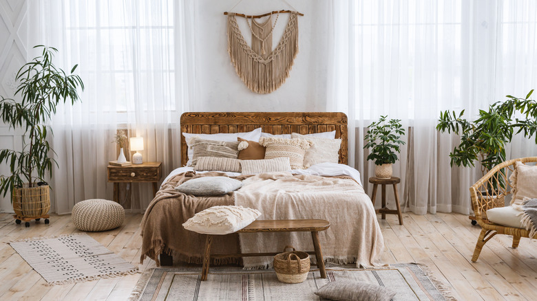 Bedroom filled with neutral colors and rattan furniture