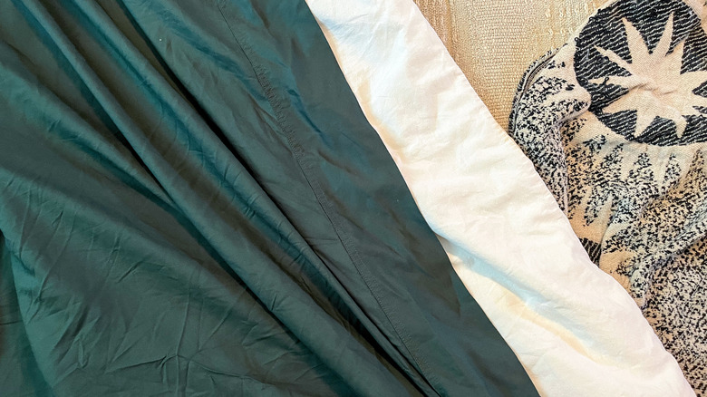 forest green Bedsure bamboo Rayon sheets on a bed with a white duvet and throw blanket