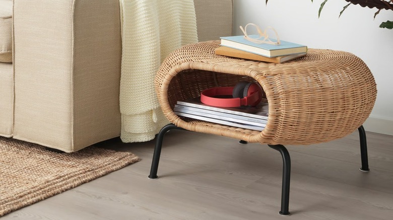 GAMLEHULT Ottoman with storage beside living room couch