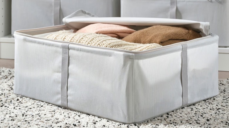 Open HEMMAFIXARE Storage case full of sweaters