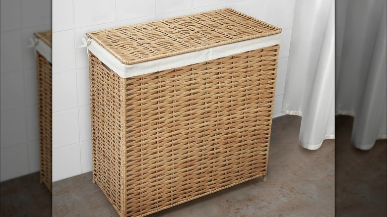 NATTGIBBA Laundry basket in bathroom