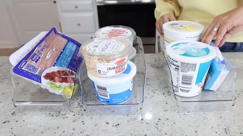 Soda can organizers filled with random refrigerated items
