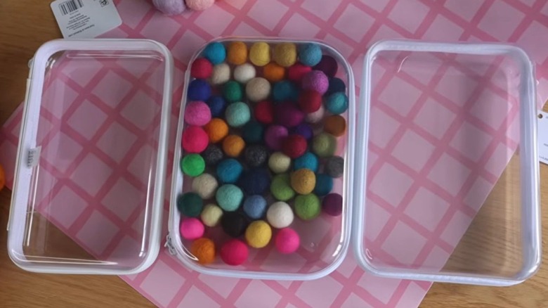 Clear zipper cases filled with craft supplies