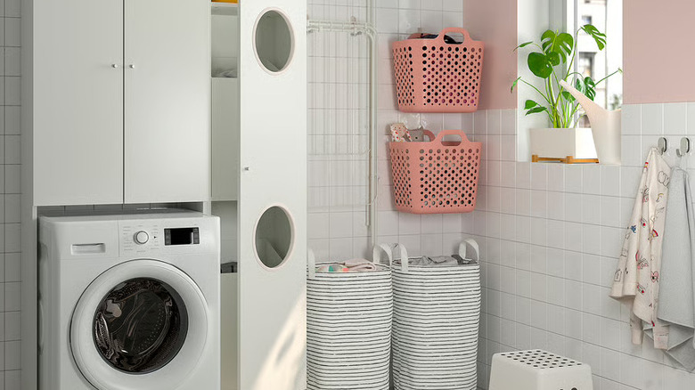 the NYSJÖN Laundry Cabinet next to a washer in laundry room