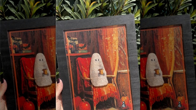 Rustic Dollar Tree ghost photo in a black frame with a green background