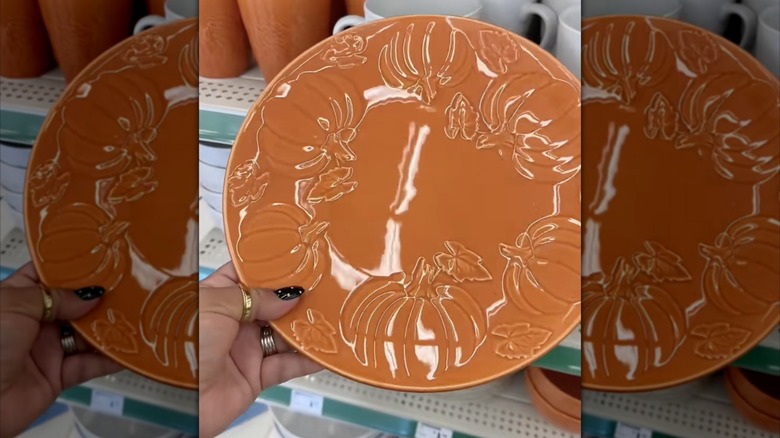 Orange plate with pumpkin motifs in Dollar Tree store