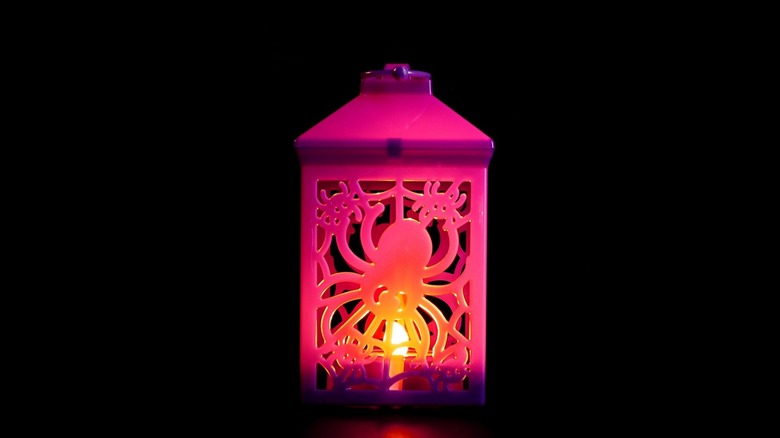A glowing Halloween lantern with a spider