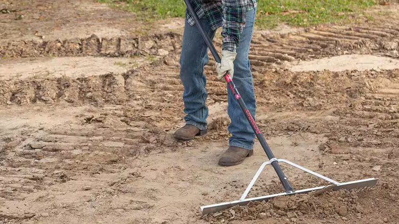 Leveling a construction site with a Razor-Back landscaping rake