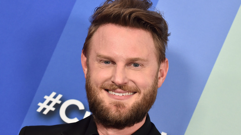 Bobby Berk showing off lamp fixture