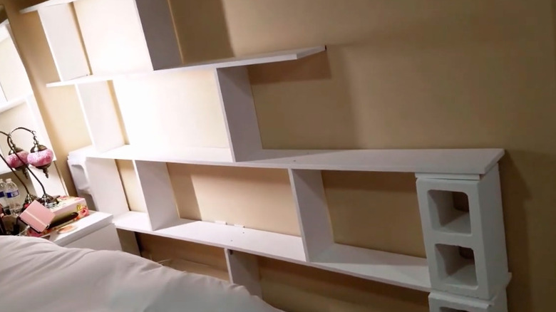 White bookshelf made from concrete blocks and boards