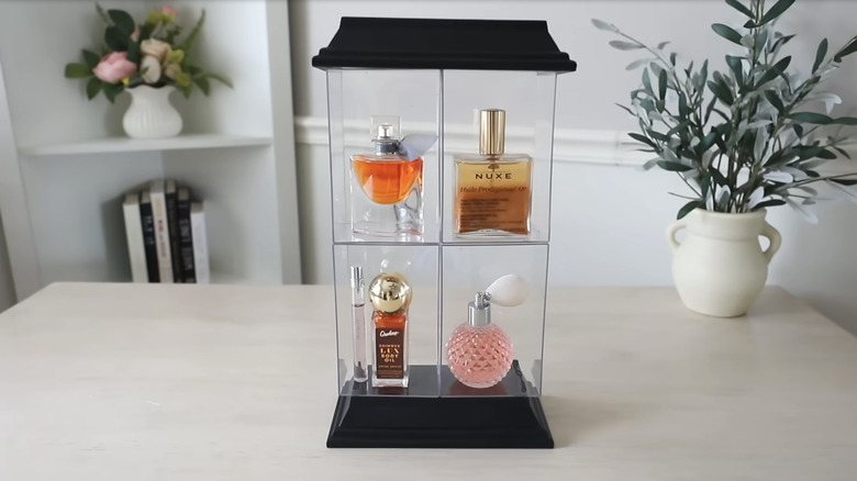 Bathroom display case made from Dollar Tree's floating shelves