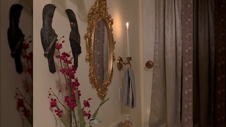 Hand towel hanging from a vintage candle sconce