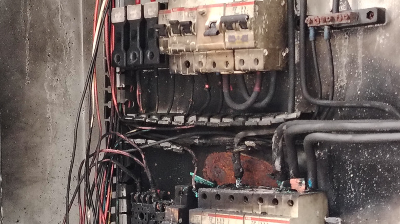 An old electrical panel that has been burned