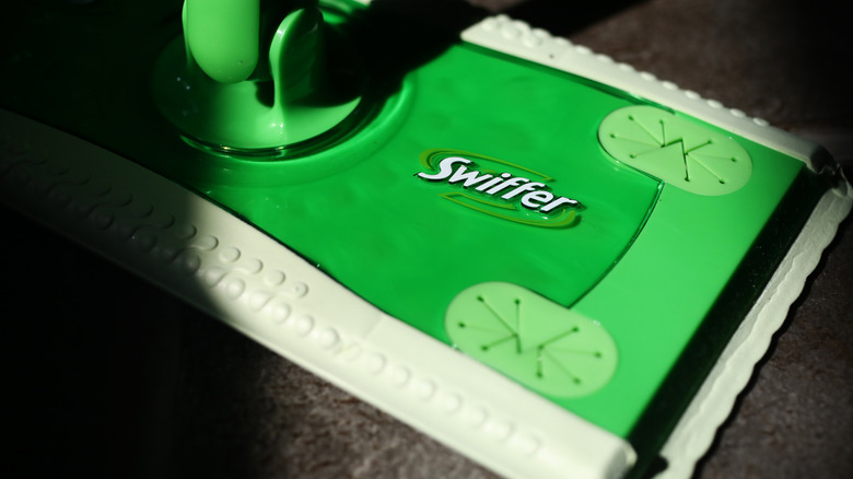 close up of Swiffer sweeper on tile floor