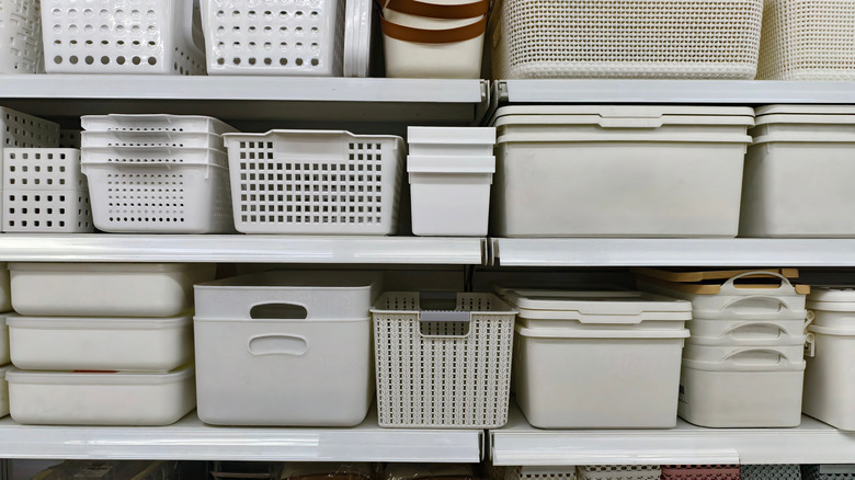 shelves at store with many different grey storage containers