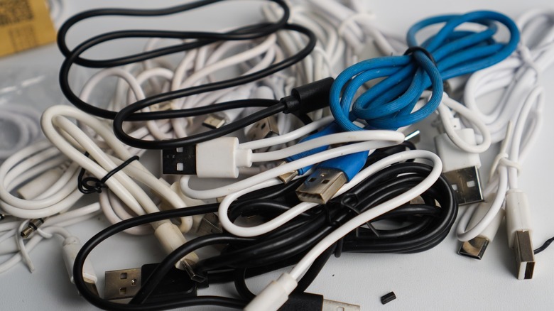 pile of phone cords on a table