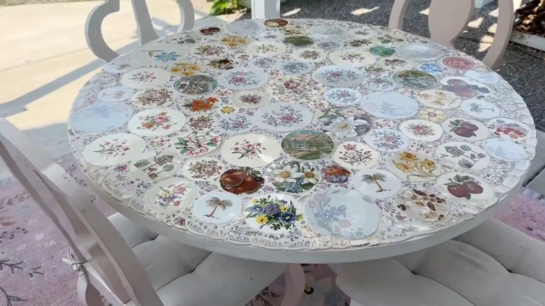 Mosaic outdoor dining table made using vintage china plates.