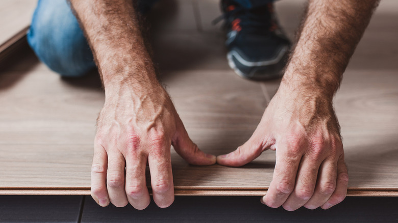Connecting planks of click-lock flooring