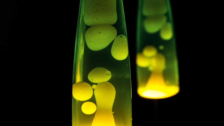 Two yellow-green lava lamps are bubbling