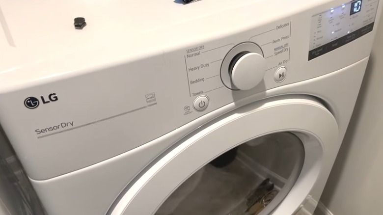 LG DLE3400W dryer in a laundry room
