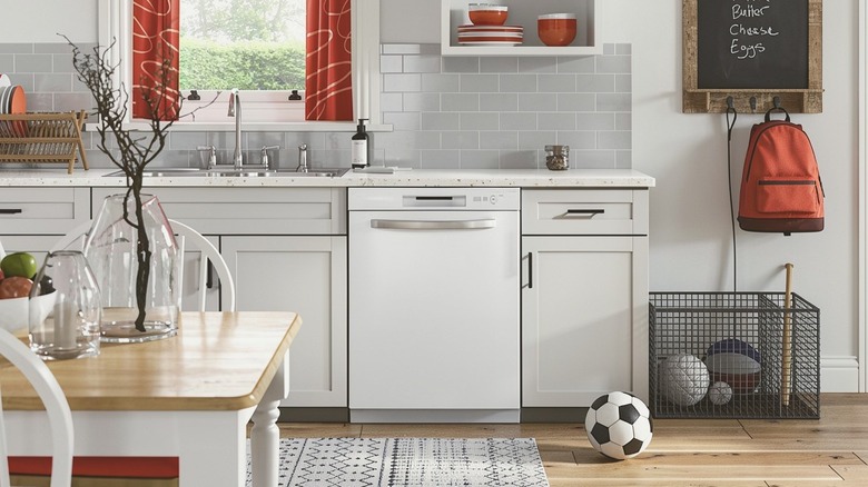 A Hotpoint HDF330PGRWW Dishwasher installed in a kitchen