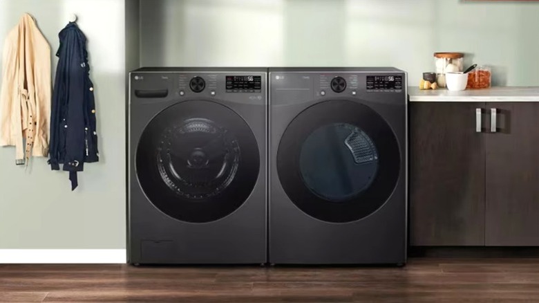 LG washer/dryer combo sitting side by side in a laundry room