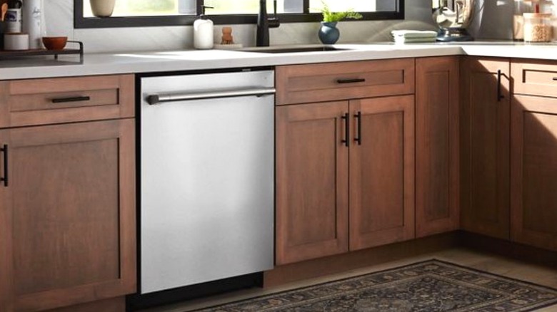 Maytag dishwasher installed in oak kitchen cabinet
