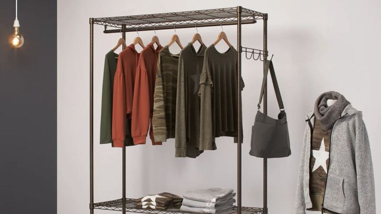 Costco garment rack with clothes hanging on it