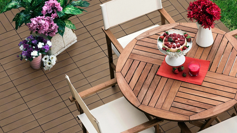 Golden Select WPC Deck Tiles under a small dining table