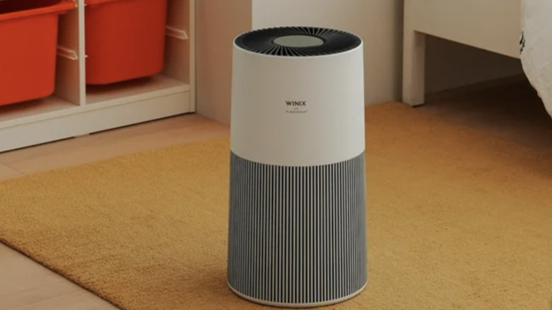 air purifier on the floor in a colorful children's bedroom