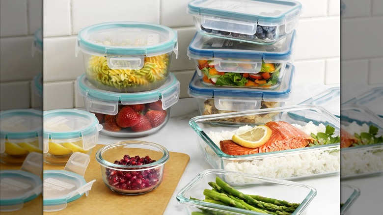 Pyrex set on a kitchen countertop with various foods store in the containers