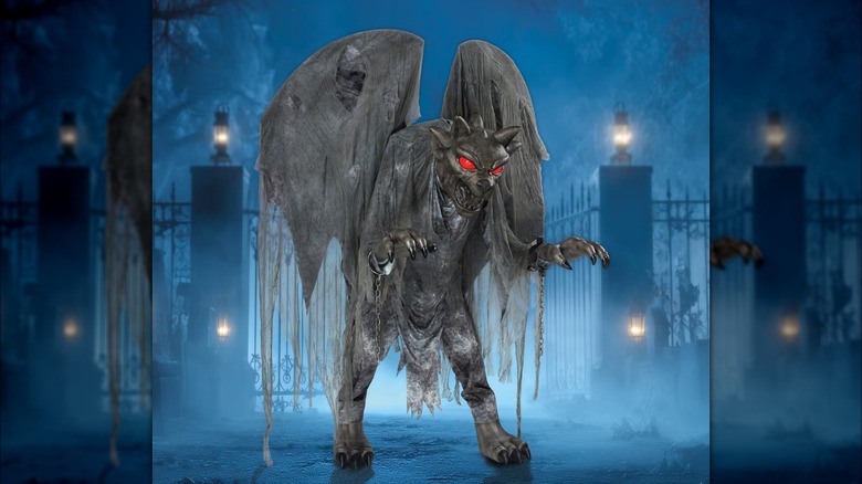 An evil-looking gargoyle with its claws extended, mouth open, wings flaring out, and eyes glowing red