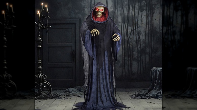 A giant robe-clothed reaper with its arms extended and eyes glowing red