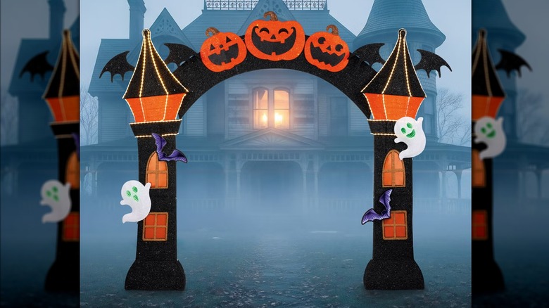 An adorable Halloween arch placed in front of a house