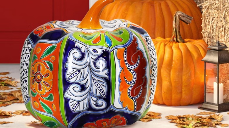 An intricately designed hand-painted ceramic pumpkin
