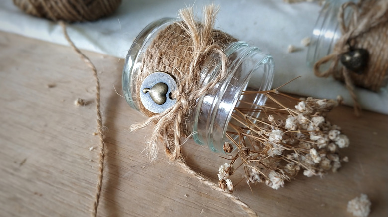Three glass jars painted and decorated