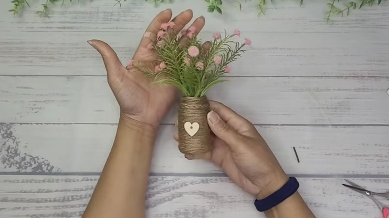 Decorative small vase made of jute twine-wrapped medicine bottle