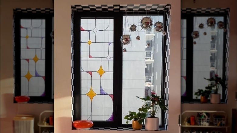 A faux stained glass window with decorative elements and paint above a shoe rack