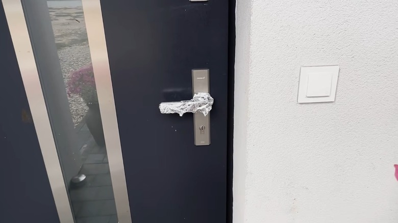 Aluminum foil wrapped around a door's handle