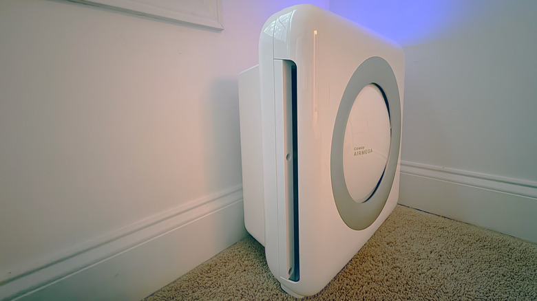 A Coway Airmega Mighty sits in a narrow bedroom corner