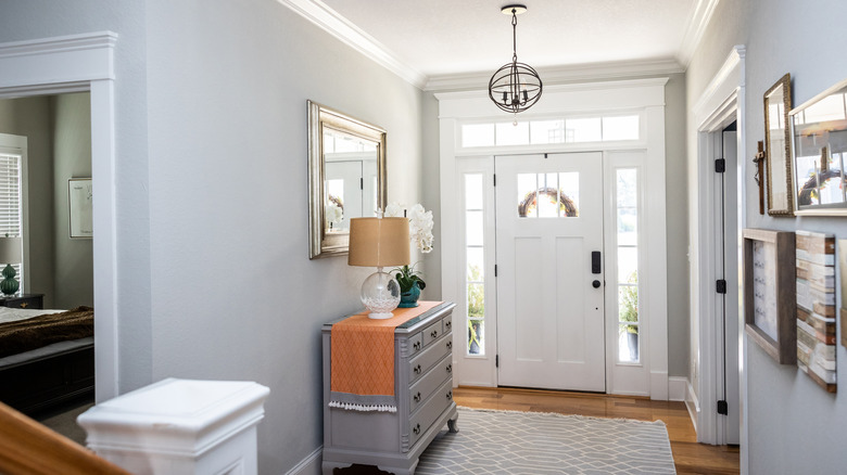 Home entryway interior with gray walls