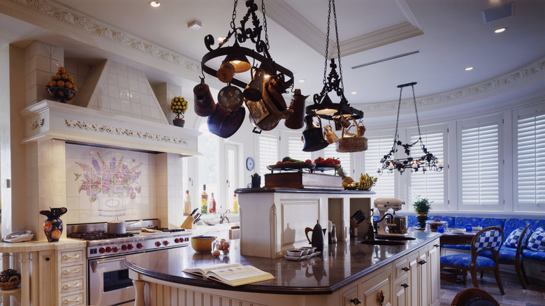 Kitchen with pot racks hanging from the ceiling