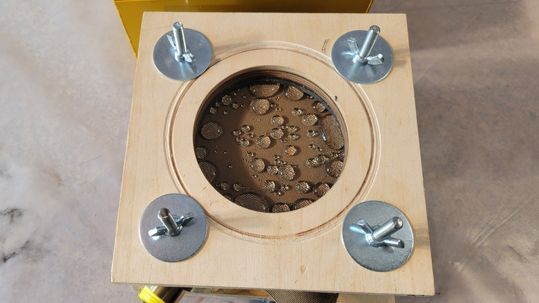 Drops visible on untreated fabric before any pressure was applied